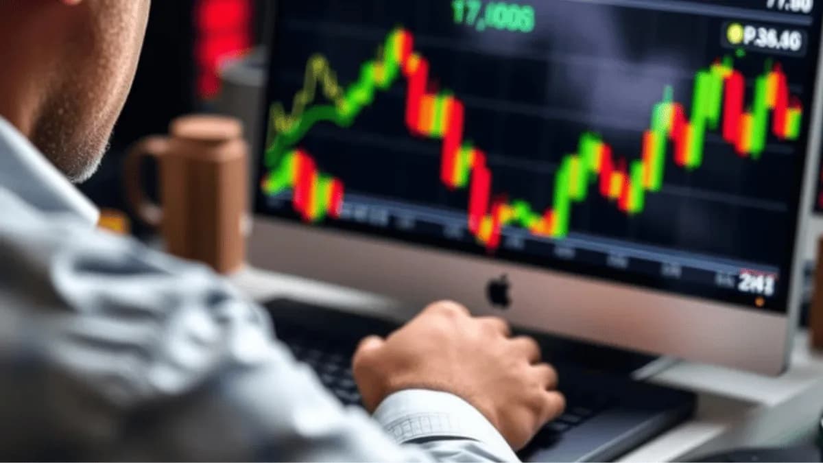 man sitting at a trading screen monitoring hsi positions